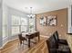 Elegant dining room featuring a modern chandelier, stylish decor, and a dining table set for a meal at 2527 Fossil Stone Ln, Fort Mill, SC 29708