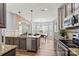 Bright kitchen boasting stainless steel appliances, wooden floors, and granite countertops at 2527 Fossil Stone Ln, Fort Mill, SC 29708