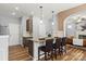 Modern kitchen with an island, granite countertops, stylish pendant lighting, and stainless steel appliances at 2527 Fossil Stone Ln, Fort Mill, SC 29708