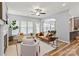 Bright and airy living room with a fireplace, modern furnishings, and ample natural light from large windows at 2527 Fossil Stone Ln, Fort Mill, SC 29708