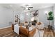 Well-lit living room showcasing an archway, fireplace, modern decor, and comfortable seating arrangement at 2527 Fossil Stone Ln, Fort Mill, SC 29708