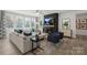 Cozy living room with a fireplace, comfortable seating, and plenty of natural light at 2541 Mabel Ln, Monroe, NC 28110