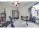 Bright exercise room with ceiling fan, large window, and lots of workout equipment at 264 Auburn View Rd, Rock Hill, SC 29730