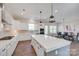 Modern kitchen with white cabinets, large island, pendant lighting, and stainless steel appliances at 264 Auburn View Rd, Rock Hill, SC 29730
