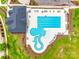 Overhead aerial view of a modern community pool with distinct swim and lounge zones amidst lush greenery at 264 Auburn View Rd, Rock Hill, SC 29730