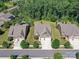 Aerial view of a beautiful home in a well-manicured neighborhood with mature trees at 2972 Arches Bluff Cir, Lancaster, SC 29720