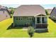 Beautiful lawn and patio area in backyard with screened in porch at 2972 Arches Bluff Cir, Lancaster, SC 29720