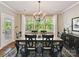 Dining room featuring large window, modern chandelier, and seating for six, perfect for Gathering meals at 2972 Arches Bluff Cir, Lancaster, SC 29720