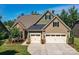 Charming home with a two-car garage, stone accents and manicured lawn at 2972 Arches Bluff Cir, Lancaster, SC 29720