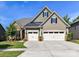 Traditional home with a three-car garage and a well-manicured lawn at 2972 Arches Bluff Cir, Lancaster, SC 29720