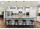 Modern kitchen island with granite countertops, stainless steel appliances, pendant lighting, and breakfast bar seating at 2972 Arches Bluff Cir, Lancaster, SC 29720