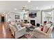 Cozy living room with fireplace, ceiling fan, and ample seating creating a comfortable atmosphere at 2972 Arches Bluff Cir, Lancaster, SC 29720