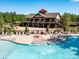 Community pool featuring ample seating and an outdoor entertaining area at 2972 Arches Bluff Cir, Lancaster, SC 29720