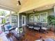 Covered back porch with outdoor seating and dining, perfect for enjoying a cup of coffee or a Gathering meal at 2972 Arches Bluff Cir, Lancaster, SC 29720