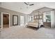 Spacious main bedroom features soft, neutral colors, trey ceiling, and lots of natural light at 304 Coronado Ave, Matthews, NC 28104