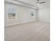 This spacious bedroom has neutral carpeting and large windows that provide ample natural light at 308 Alameda Way, Matthews, NC 28104