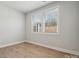 Bright bedroom with wood floors, a large window and base trim at 308 Alameda Way, Matthews, NC 28104
