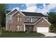 Charming two-story brick home with attached two car garage and landscaped front yard at 308 Alameda Way, Matthews, NC 28104
