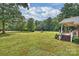 Spacious backyard with a well-manicured lawn, offering an ideal setting for outdoor activities and enjoyment at 321 York Southern Rd, Fort Mill, SC 29715