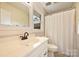 Bathroom with white vanity and a shower/tub combination with white shower curtain at 321 York Southern Rd, Fort Mill, SC 29715