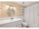 Bathroom with white vanity and a shower/tub combination with white shower curtain at 321 York Southern Rd, Fort Mill, SC 29715