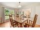 Traditional dining room with hardwood floors and view to the yard through a large window at 321 York Southern Rd, Fort Mill, SC 29715