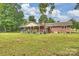 Charming brick home featuring a screened gazebo and covered porch perfect for enjoying the outdoors at 321 York Southern Rd, Fort Mill, SC 29715