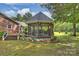 Charming gazebo with screened walls surrounded by manicured landscaping, offering a private outdoor retreat at 321 York Southern Rd, Fort Mill, SC 29715
