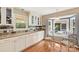 Bright eat-in kitchen features white cabinets, granite counters, and a sunny breakfast nook at 321 York Southern Rd, Fort Mill, SC 29715
