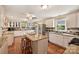 Spacious kitchen featuring an island, modern appliances, granite countertops, and ample cabinet space at 321 York Southern Rd, Fort Mill, SC 29715