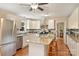 Updated kitchen featuring stainless appliances, stone countertops, and center island with seating at 321 York Southern Rd, Fort Mill, SC 29715