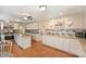 Spacious kitchen features white cabinets, granite counters, stainless appliances, and a center island at 321 York Southern Rd, Fort Mill, SC 29715