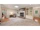 Bright living room featuring a brick fireplace with built-in shelves and neutral decor at 321 York Southern Rd, Fort Mill, SC 29715