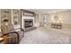 Cozy living room featuring a brick fireplace, built-in shelves, and comfortable armchair at 321 York Southern Rd, Fort Mill, SC 29715