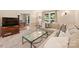 Spacious living room with plush seating, brick fireplace, and open access to the dining area at 321 York Southern Rd, Fort Mill, SC 29715