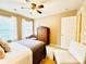 Bright bedroom with carpet flooring, a bed, wardrobe, chair and entry to a bathroom at 4048 Cascade Dr, Gastonia, NC 28056