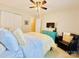 Bright bedroom with a ceiling fan, bed, dresser, tv and a black armchair at 4048 Cascade Dr, Gastonia, NC 28056