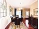 Inviting dining room featuring a dark wood table with seating for six and modern decorative accents at 4048 Cascade Dr, Gastonia, NC 28056
