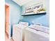 Bright and airy laundry room with modern washer and dryer, a 'Wash and Dry' sign, and a convenient shelf at 4048 Cascade Dr, Gastonia, NC 28056