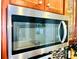 Close-up of a stainless steel Whirlpool microwave with a sleek design and modern features in a stylish kitchen at 4048 Cascade Dr, Gastonia, NC 28056