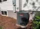 Side view of home's AC unit with pine straw ground cover at 419 W 8Th St, Newton, NC 28658