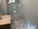 Stylish bathroom with a marble floor, modern vanity, and glass-enclosed shower at 419 W 8Th St, Newton, NC 28658