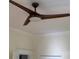 Bedroom showing ceiling fan, crown molding, and neutral wall color at 419 W 8Th St, Newton, NC 28658
