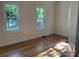 Bright bedroom with two windows and hardwood floors at 419 W 8Th St, Newton, NC 28658