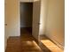 Bedroom with hardwood floors, baseboard trim and view of hallway at 419 W 8Th St, Newton, NC 28658