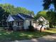 Charming home with manicured lawn, featuring a covered front porch and mature landscaping at 419 W 8Th St, Newton, NC 28658
