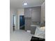 Kitchen with gray cabinets, marble countertops, and view of a doorway at 419 W 8Th St, Newton, NC 28658