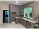 Kitchen with gray cabinets, marble countertops, and stainless steel appliances at 419 W 8Th St, Newton, NC 28658