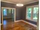 Living room with hardwood floors, gray walls, and natural light at 419 W 8Th St, Newton, NC 28658