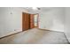 Bedroom featuring neutral carpet and ceiling fan, with direct access to an exterior room at 4323 Crow Rd, Monroe, NC 28112